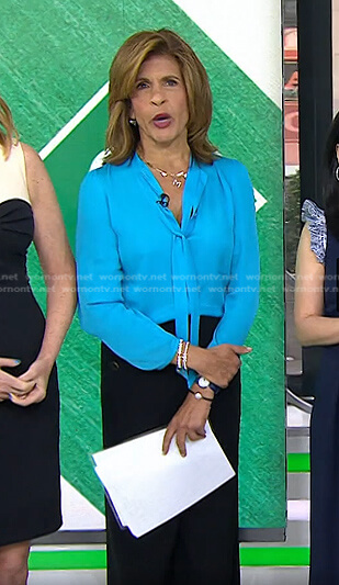 Hoda’s blue tie neck blouse and black pants on Today