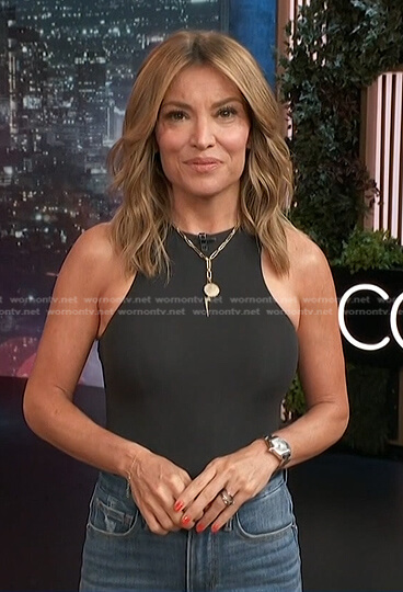Kit's black sleeveless top and flare jeans on Access Hollywood