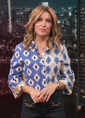 Kit's blue printed blouse and chain pocket jeans on Access Hollywood