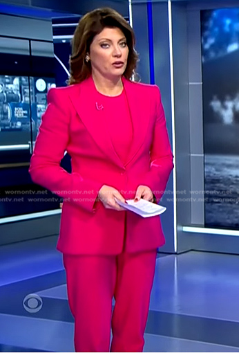 Norah’s fuchsia blazer and pants on CBS Evening News