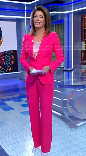 Norah's fuchsia blazer and pants on CBS Evening News