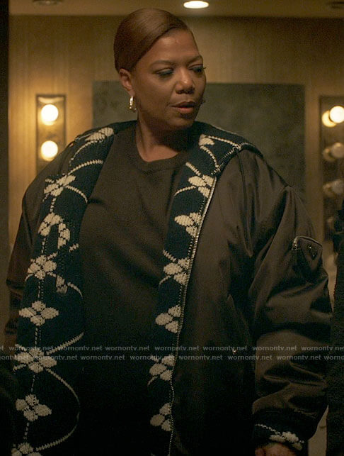 Robyn's coat with floral knit details on The Equalizer