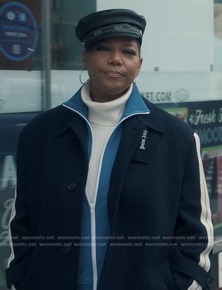 Robyn's navy coat with striped sleeves on The Equalizer