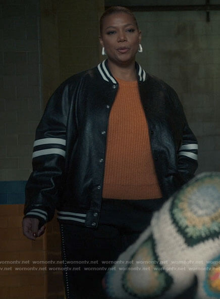 Robyn's leather bomber jacket with striped sleeves on The Equalizer