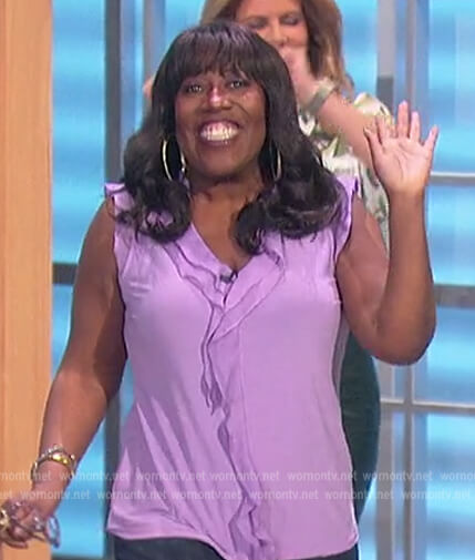 Sheryl's lavender ruffle front top on The Talk
