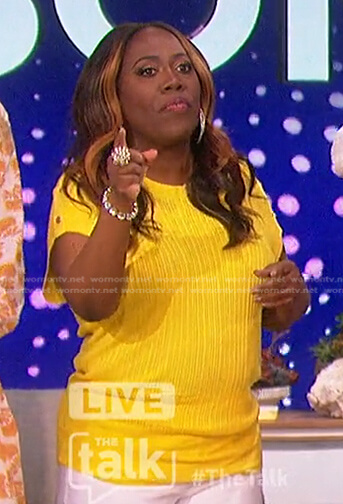 Sheryl’s yellow button-shoulder top on The Talk