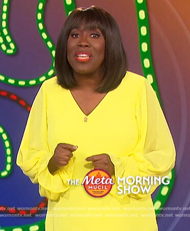 Sheryl’s yellow v-neck top on The Talk