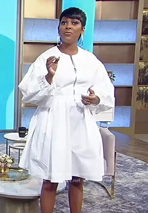 Tamron’s white half zip mini dress on Tamron Hall Show