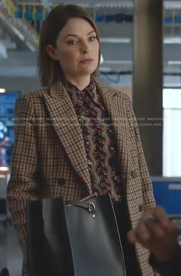 Taylor’s black floral blouse and beige plaid coat on Bull