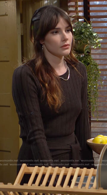 Tessa’s buttoned sleeve sweater and tie front skirt on The Young and the Restless