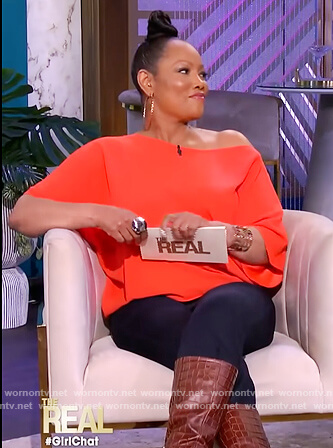 Garcelle’s coral one off shoulder top on The Real