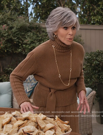 Grace’s beige turtleneck belted sweater on Grace and Frankie