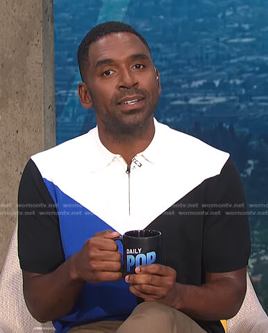 Justin's black, blue and white colorblock polo shirt on E! News