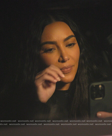 Kim's black logo mock neck top on The Kardashians