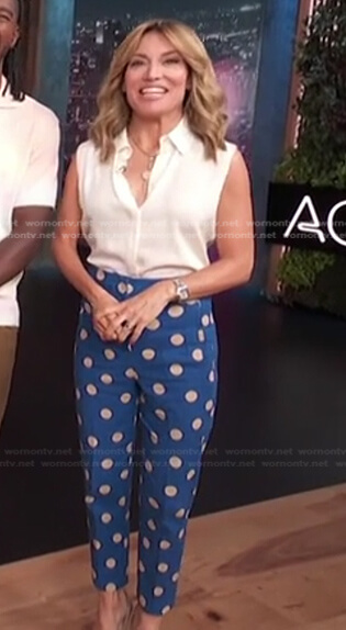 Kit’s white sleeveless blouse and blue polka dot pants on Access Hollywood