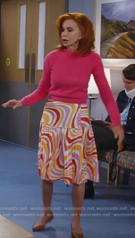 Sheila’s pink sweater and pleated swirl print skirt on Call Me Kat