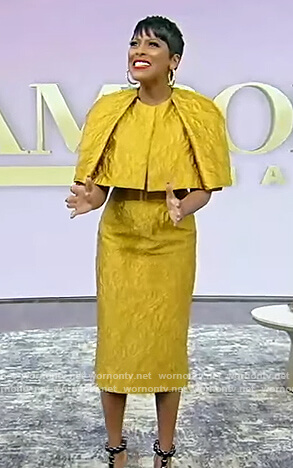 Tamron's gold cape top and skirt on Tamron Hall Show