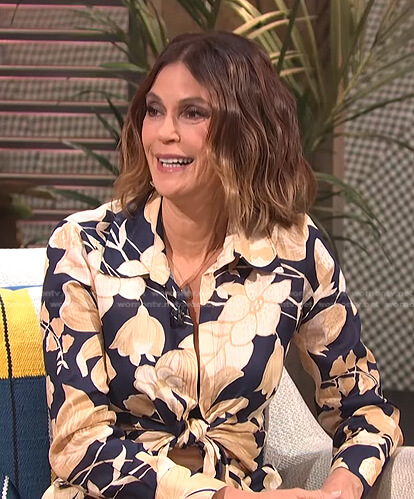 Teri Hatcher’s navy floral tie front blouse and skirt on E! News Daily Pop
