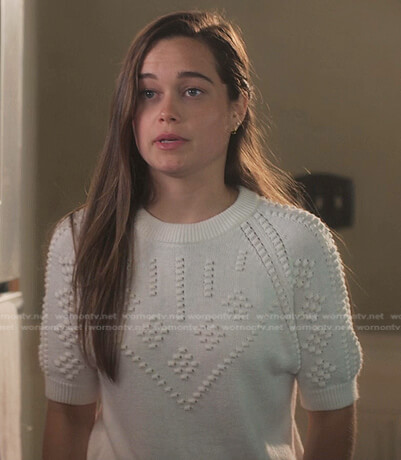 Juliette's white short sleeve knit sweater and plaid mini skirt on First Kill