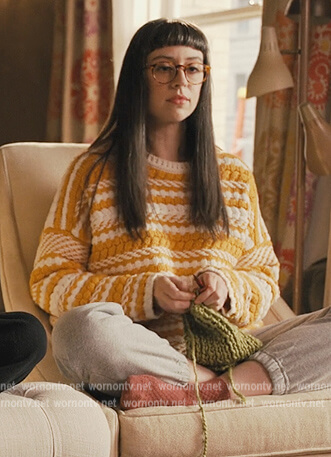 Poppy's yellow stripe sweater on Only Murders in the Building