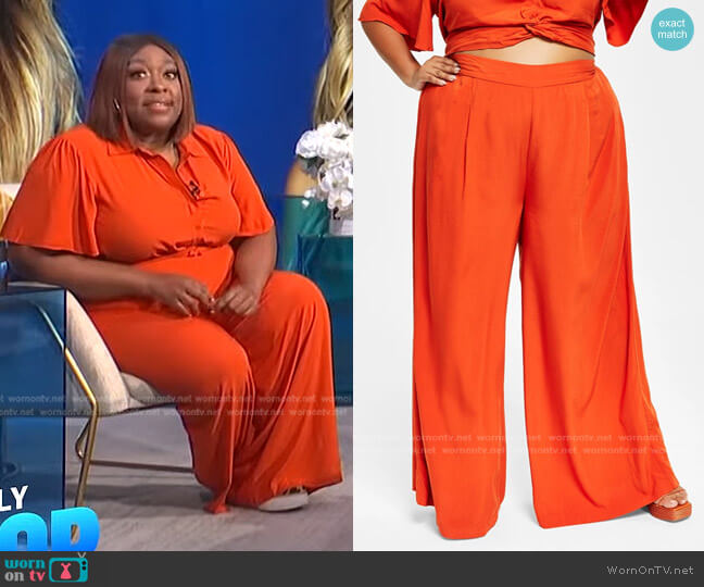 WornOnTV: Loni’s orange knotted top and wide-leg pants on E! News Daily ...