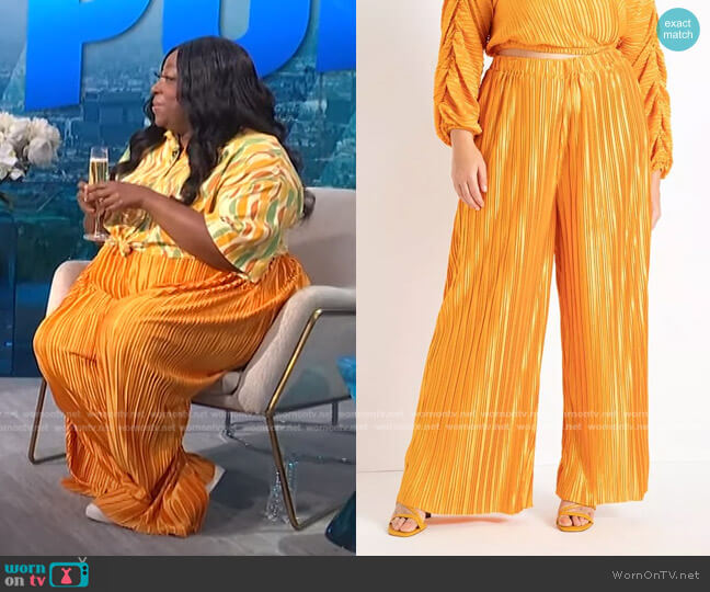 WornOnTV: Loni’s geometric shirt and orange pleated pants on E! News ...