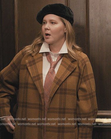 Amy's mustard check coat on Only Murders in the Building