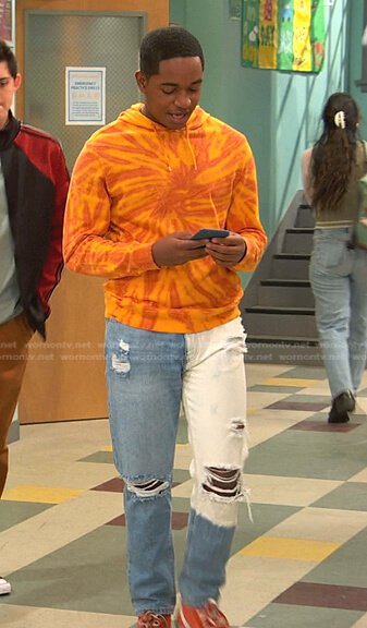 Booker's orange tie dye hoodie and colorblock jeans on Ravens Home