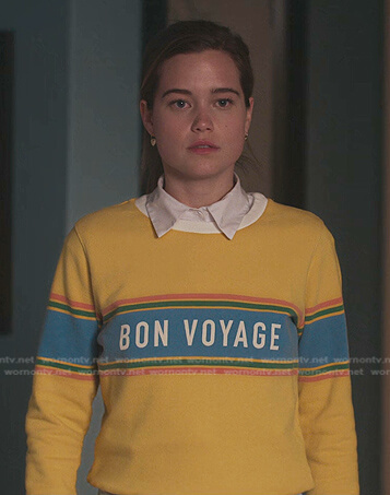 Juliette's yellow Bon Voyage sweatshirt on First Kill