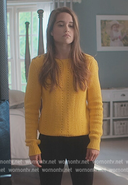 Juliette's yellow button shoulder sweater on First Kill