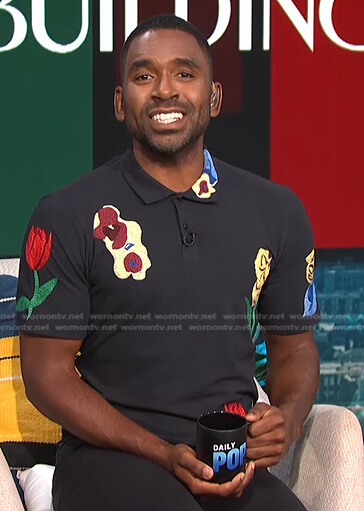 Justin's black floral embroidered polo shirt on E! News Daily Pop