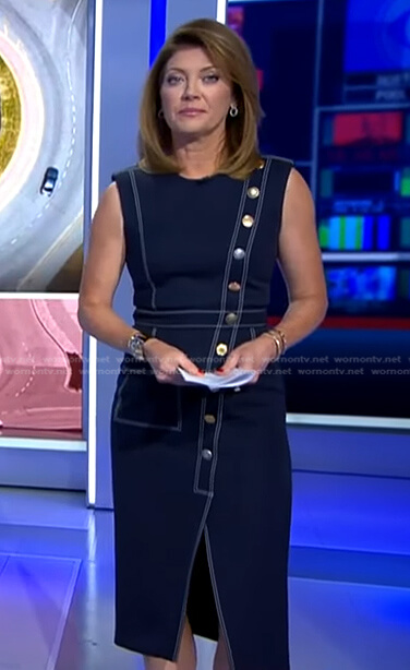 Norah’s black asymmetric button dress on CBS Evening News