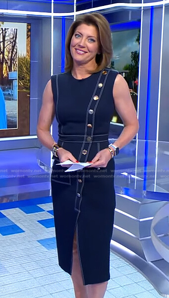 Norah’s black asymmetric button dress on CBS Evening News