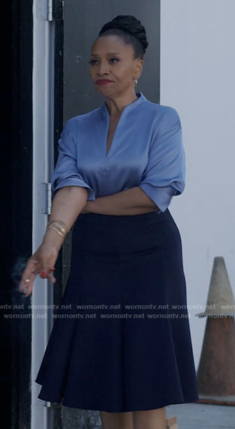 Patricia’s blue satin split-neck blouse on I Love That For You