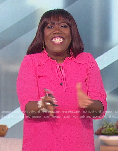 Sheryl's pink textured tie neck blouse on The Talk
