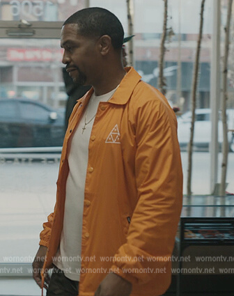 Darnell’s orange button down jacket on The Chi