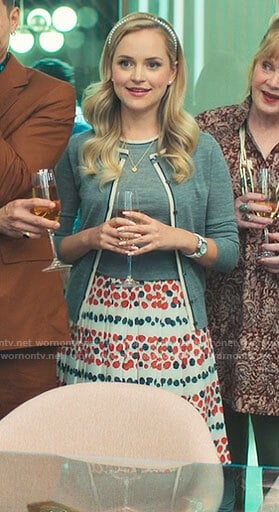 Ainsley’s grey sweater and printed skirt on Loot