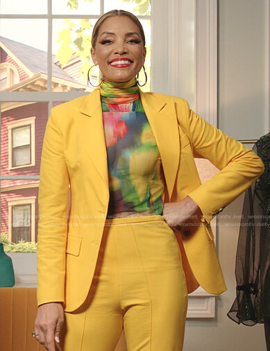 Dominique’s multicolor top and yellow suit on Dynasty