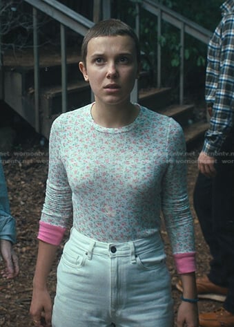 The blue-collared top worn by Eleven (Millie Bobby Brown) in the series Stranger  Things (Season 4 Episode 9)