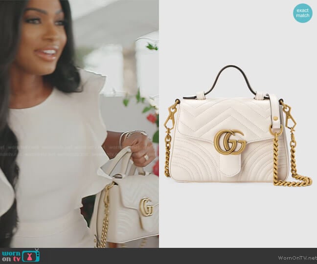 GG Marmont mini top handle bag by Gucci worn by Lesa Milan (Lesa Milan) on The Real Housewives of Dubai