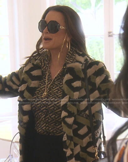 Kyle’s black geometric print blouse and coat on The Real Housewives of Beverly Hills