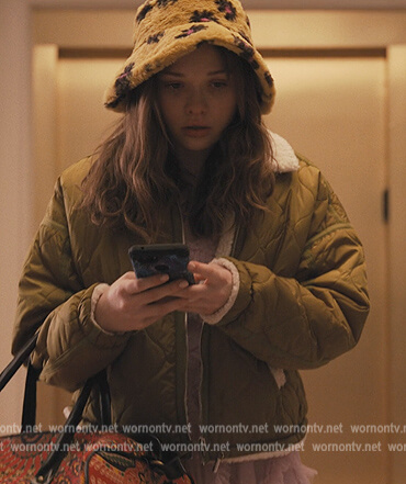 Lucy’s green puffer sherpa jacket on Only Murders in the Building