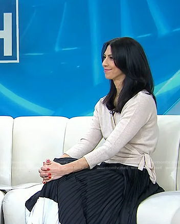 Dr. Natalie Azar’s black blouse and colorblock pleated skirt on Today