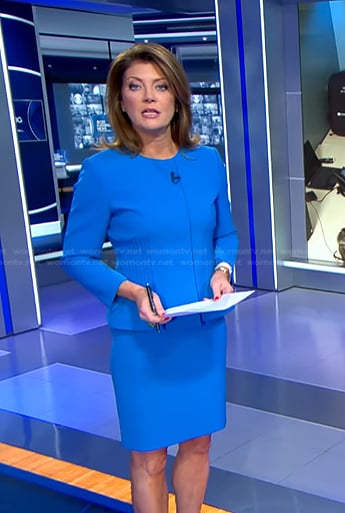 Norah’s blue peplum jacket and skirt on CBS Evening News