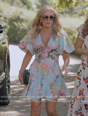 Tamra's blue floral print puff sleeve mini dress on The Real Housewives Ultimate Girls Trip