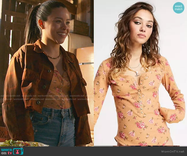 Free People Dylan Floral Printed Henley Bodysuit in peach worn by Mariana Foster (Cierra Ramirez) on Good Trouble
