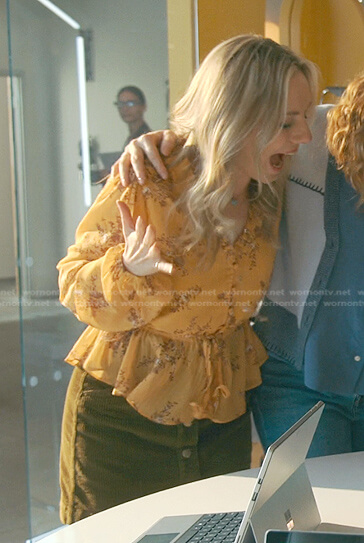 Claire's yellow floral blouse and corduroy skirt on Good Trouble