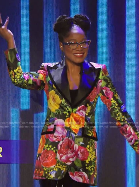 Keke Palmer with her unique glasses and fashion modeling clothing.
