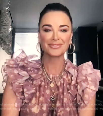 Kyle Richards’ purple printed top with ruffle sleeves on E! News Daily Pop