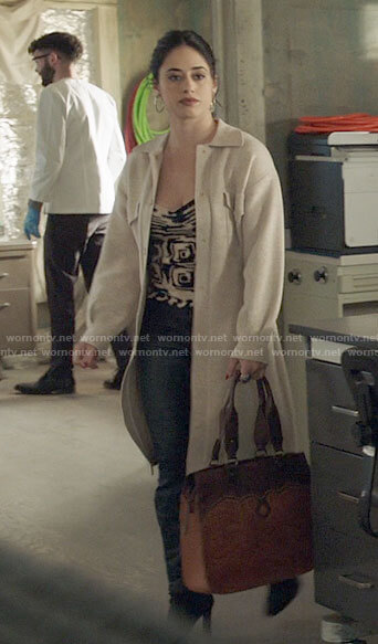Liz's tan leather bag and knit tank top on Roswell New Mexico